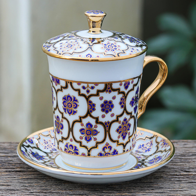 Benjarong porcelain cup and saucer, 'Blue Celebration' - Benjarong Porcelain Cup and Saucer Set