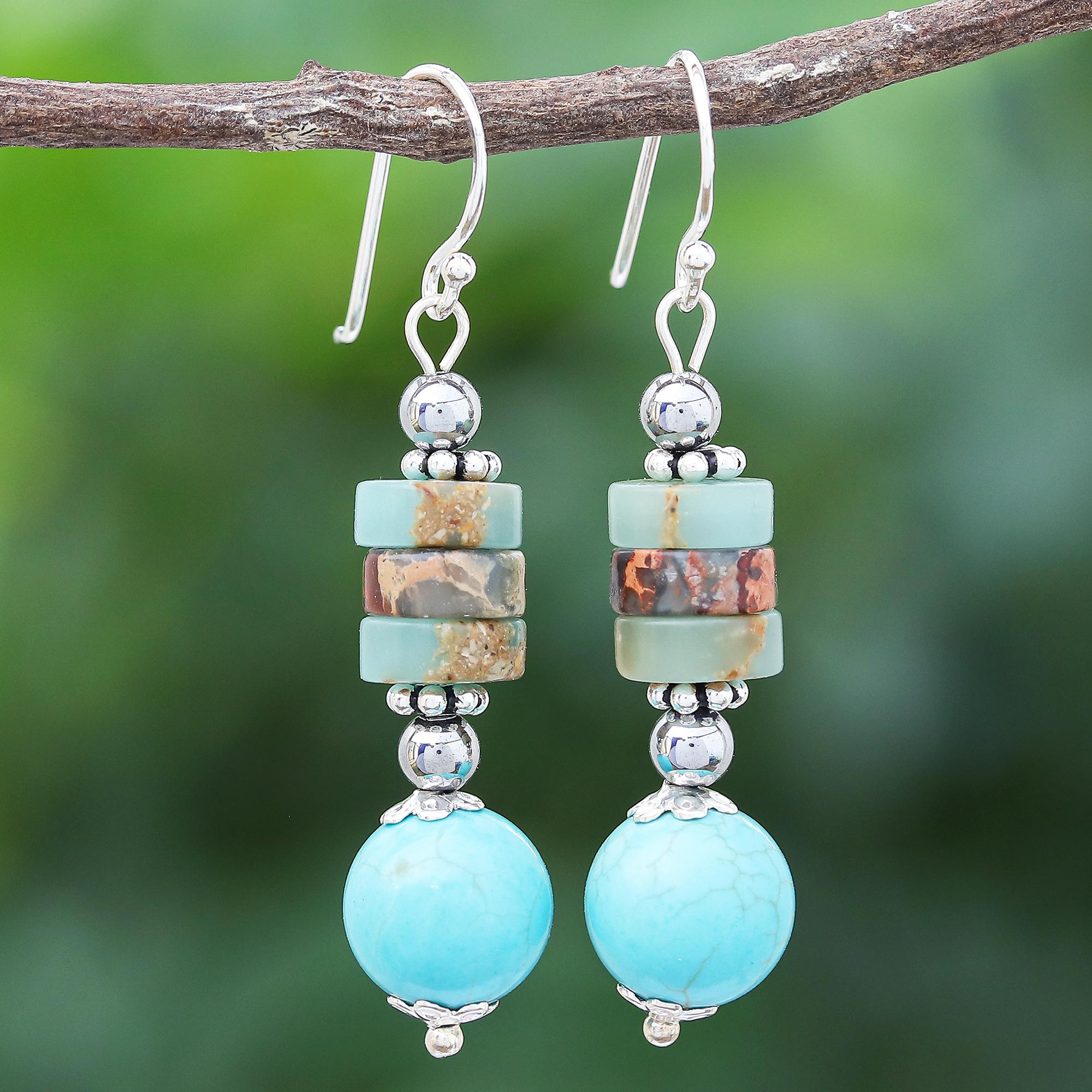 Reconstituted stone cross dangle earrings in turquoise blue or white.