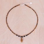 Multi-gemstone pendant necklace, 'Basking Beauty' - Handmade Tiger's Eye and Onyx Pendant Necklace