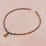 Multi-gemstone pendant necklace, 'Basking Beauty' - Handmade Tiger's Eye and Onyx Pendant Necklace