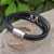 Leather pendant bracelet, 'Fanged in Black' - Hand Made Black Leather Pendant Bracelet