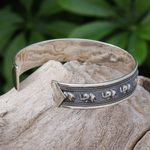 Sterling silver cuff bracelet, 'On Parade in Small' - Sterling Silver Elephant-Themed Cuff Bracelet