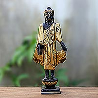Gold-accented wood sculpture, Standing Teacher