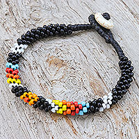 Glass beaded torsade bracelet, 'Rainbow Night' - Multicolor Glass Beaded Torsade Bracelet from Thailand