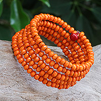 Wood beaded wrap bracelet, 'Tangerine Spin' (1 in) - Orange Beaded Wood Wrap Bracelet with Bells (1 In)