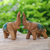 Wood sculptures, 'The Green Prosperity' (set of 2) - Set of 2 Hand-Carved Wood Elephant Sculptures with Green Hue