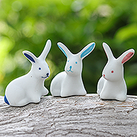 Ceramic figurines, 'Lucky Friends' (set of 3) - Set of 3 Ceramic Bunny Figurines in Pink and Blue Tones