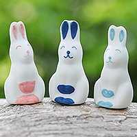 Ceramic figurines, 'Sweet Reunion' (set of 3) - Set of 3 Ceramic Figurines of Pink and Blue Bunnies