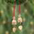 Brass ornaments, 'Elephant Tune' (pair) - Pair of Brass Bell Ornaments with Elephants and Red Ribbons thumbail
