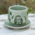 Celadon ceramic cup and saucer, 'Luxuriant Lotus' - Handmade Celadon Ceramic Green Cup and Saucer with Flowers