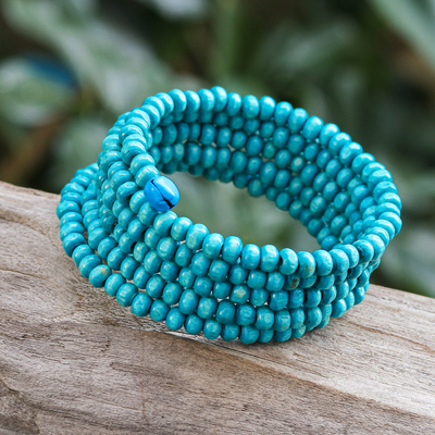 Wood beaded wrap bracelet, 'Sunshine Spin' (1 in) - Handcrafted Blue Wood Beaded Wrap Bracelet with Bells (1 In)