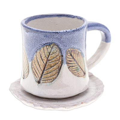 Ceramic mug and saucer, 'Charming Leaves' - Handcrafted Ceramic Mug and Saucer Set with Leaf Motif