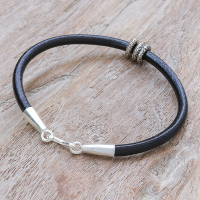 Leather pendant bracelet, 'Shadow Rings' - Sterling Silver Pendant Bracelet with Black Leather Cord