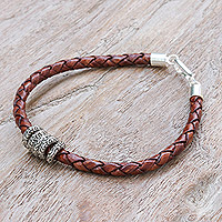Leather braided pendant bracelet, 'Ties of the Earth' - Brown Leather Braided Bracelet with Sterling Silver Pendants