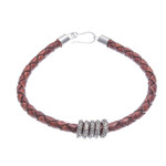 Leather braided pendant bracelet, 'Ties of the Earth' - Brown Leather Braided Bracelet with Sterling Silver Pendants