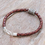 Leather braided pendant bracelet, 'Ties of the Earth' - Brown Leather Braided Bracelet with Sterling Silver Pendants