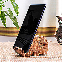 Wood phone holder, 'Helpful Trunk' - Hand-Carved Elephant-Themed Raintree Wood Phone Holder