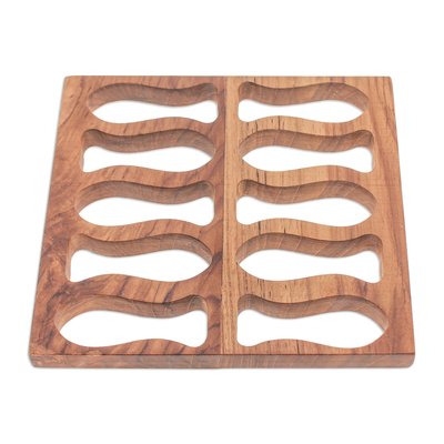 Wood pot stand, 'Swimming Delicacies' - Fish-Themed Hand-Carved Square Brown Teak Wood Pot Stand