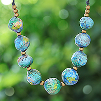 Recycled paper and brass beaded necklace, 'Planetary Blue' - Painted Recycled Paper and Brass Beaded Necklace in Blue