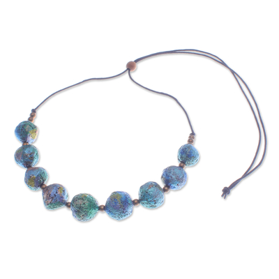 Recycled paper and brass beaded necklace, 'Planetary Blue' - Painted Recycled Paper and Brass Beaded Necklace in Blue