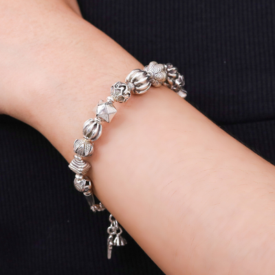 Silver beaded charm bracelet, 'Souls from the Forest' - Hill Tribe-Themed Silver Beaded Charm Bracelet