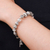Silver beaded charm bracelet, 'Souls from the Forest' - Hill Tribe-Themed Silver Beaded Charm Bracelet (image 2j) thumbail