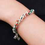 Carnelian and silver beaded charm bracelet, 'Call for Courage' - Hill Tribe-Themed Carnelian and Silver Beaded Charm Bracelet