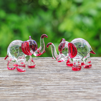 Handblown glass figurines, 'Passion Trunks' (set of 2) - Set of 2 Elephant-Themed Handblown Glass Figurines in Red