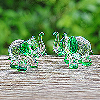 Handblown glass figurines, 'Hope Trunks' (set of 2) - Set of 2 Elephant-Themed Handblown Glass Figurines in Green