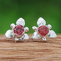 Garnet stud earrings, 'Passion Flora' - Flower-Themed Polished Faceted Garnet Stud Earrings