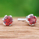 Garnet stud earrings, 'Perseverance Blooms' - Faceted Red Garnet Sterling Silver Stud Earrings