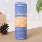 Celadon ceramic water bottle, 'Blue Bamboo' - Blue Celadon Ceramic and Rattan Bamboo-Themed Water Bottle