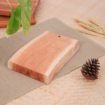 Wood cutting board, 'Strong Flavors' - Hand-Carved Sturdy Longan Wood Cutting Board from Thailand