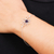 Amethyst pendant bracelet, 'Sense of Purple Calm' - Polished Lotus-Themed Amethyst Pendant Bracelet