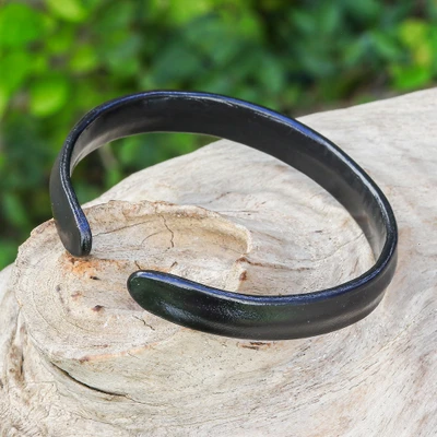 Leather cuff bracelet, 'Simply Enigmatic' - Handcrafted Modern Leather Cuff Bracelet in Black