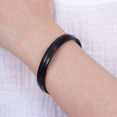 Leather cuff bracelet, 'Simply Enigmatic' - Handcrafted Modern Leather Cuff Bracelet in Black