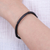 Leather cuff bracelet, 'Mysterious Bamboo' - Bamboo-Inspired Adjustable Black Leather Cuff Bracelet