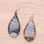 Handblown glass dangle earrings, 'Black Ovate Leaf' - Handblown Glass Dangle Earrings with Black Spirals