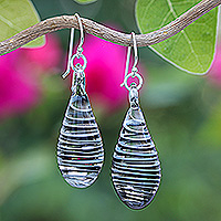 Handblown glass dangle earrings, 'Dew Drop in Black' - Handblown Glass Dangle Earrings with Black & White Spirals