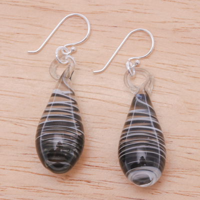 Handblown glass dangle earrings, 'Dew Drop in Black' - Handblown Glass Dangle Earrings with Black & White Spirals