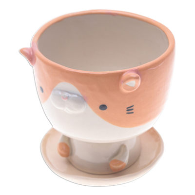 Mini macetero de cerámica. - Mini maceta de cerámica con platillo, color naranja marfil y forma de gato