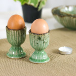 Celadon ceramic egg cups, 'Green Treats' (pair) - Lotus-Themed Crackled Green Celadon Ceramic Egg Cups (Pair)