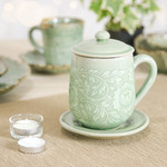 Celadon ceramic lidded cup and saucer, 'Luxury Peony in Green' - Floral Crackled Green Celadon Ceramic Covered Cup and Saucer