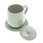 Celadon ceramic lidded cup and saucer, 'Luxury Peony in Green' - Floral Crackled Green Celadon Ceramic Covered Cup and Saucer