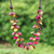 Wood and coconut shell beaded strand necklace, 'Cycles of Tenderness' - Fuchsia and Golden Round Wood Beaded Three-Strand Necklace