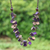 Wood and coconut shell beaded strand necklace, 'Cycles of Magic' - Purple and Brown Round Wood Beaded Three-Strand Necklace