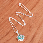 Sterling silver pendant necklace, 'Sacred Peace Bloom' - Floral Om-Themed Reconstituted Turquoise Pendant Necklace