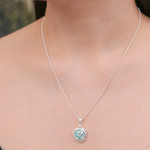 Sterling silver pendant necklace, 'Sacred Peace Bloom' - Floral Om-Themed Reconstituted Turquoise Pendant Necklace