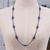 Lapis lazuli and garnet beaded long station necklace, 'Midnight Touch' - Long Station Necklace with Lapis Lazuli and Garnet Stones