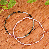 Rhodochrosite and tourmaline beaded stretch bracelets, 'Double Spell' (pair) - Pair of Rhodochrosite Tourmaline Beaded Stretch Bracelets